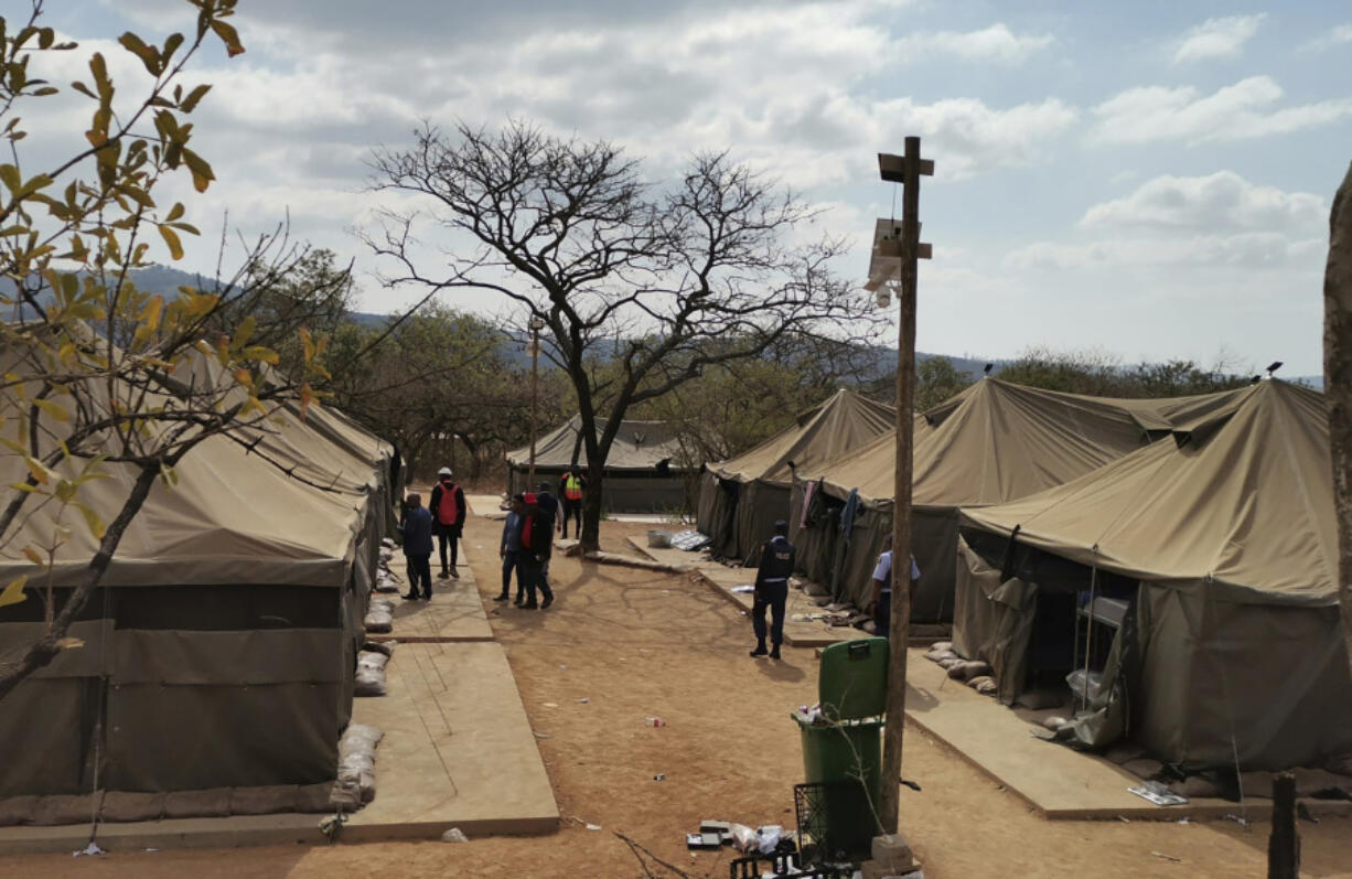 A camp where 95 Libyan nationals were arrested on suspicion of running an illegal military camp are seen lining up after their arrest on Friday July 26, 2024 in White River, South Africa.