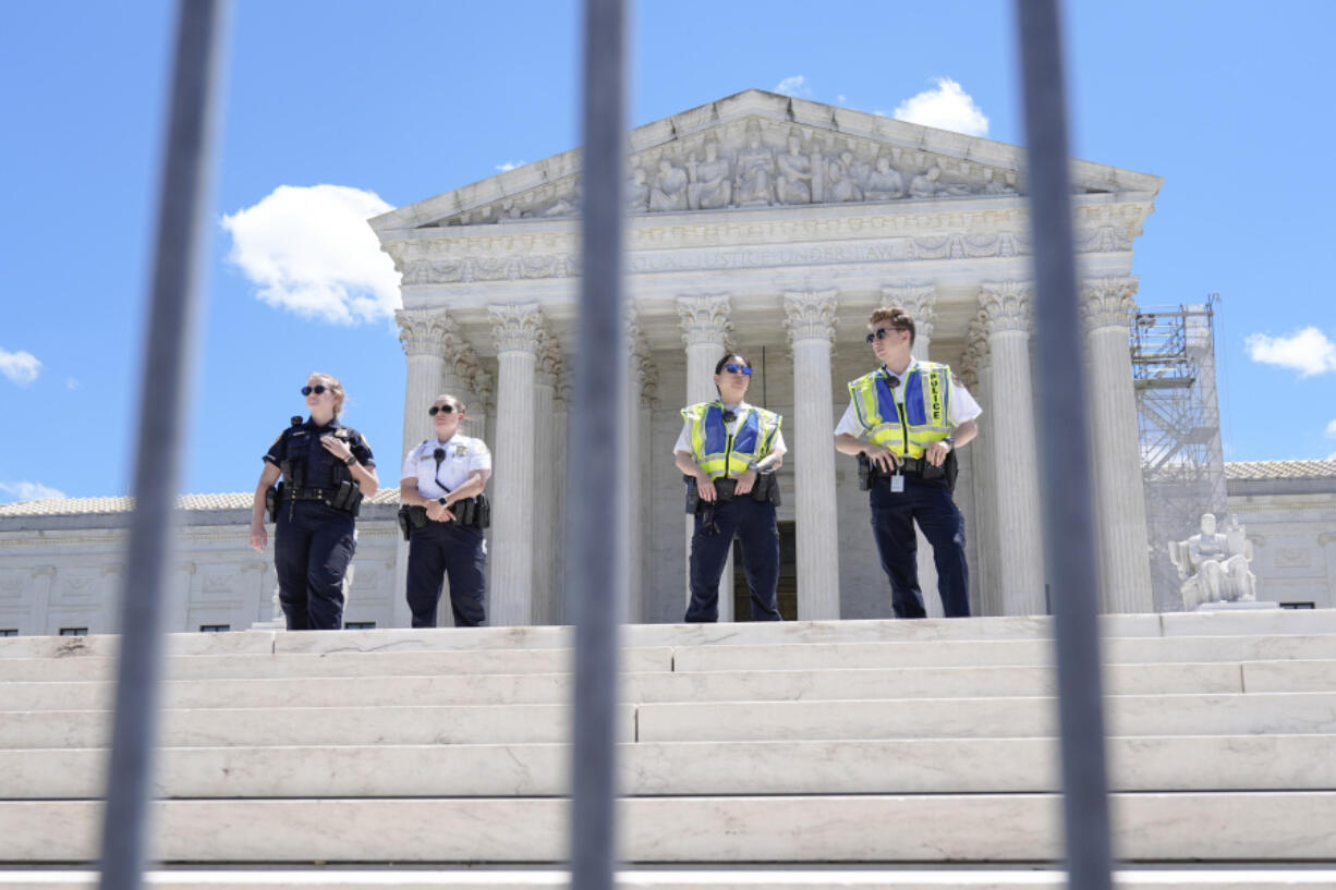 Supreme Court Police officers stand outside the Supreme Court Monday, July 1, 2024, in Washington.
