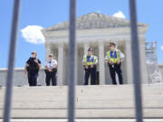 Supreme Court Police officers stand outside the Supreme Court Monday, July 1, 2024, in Washington.