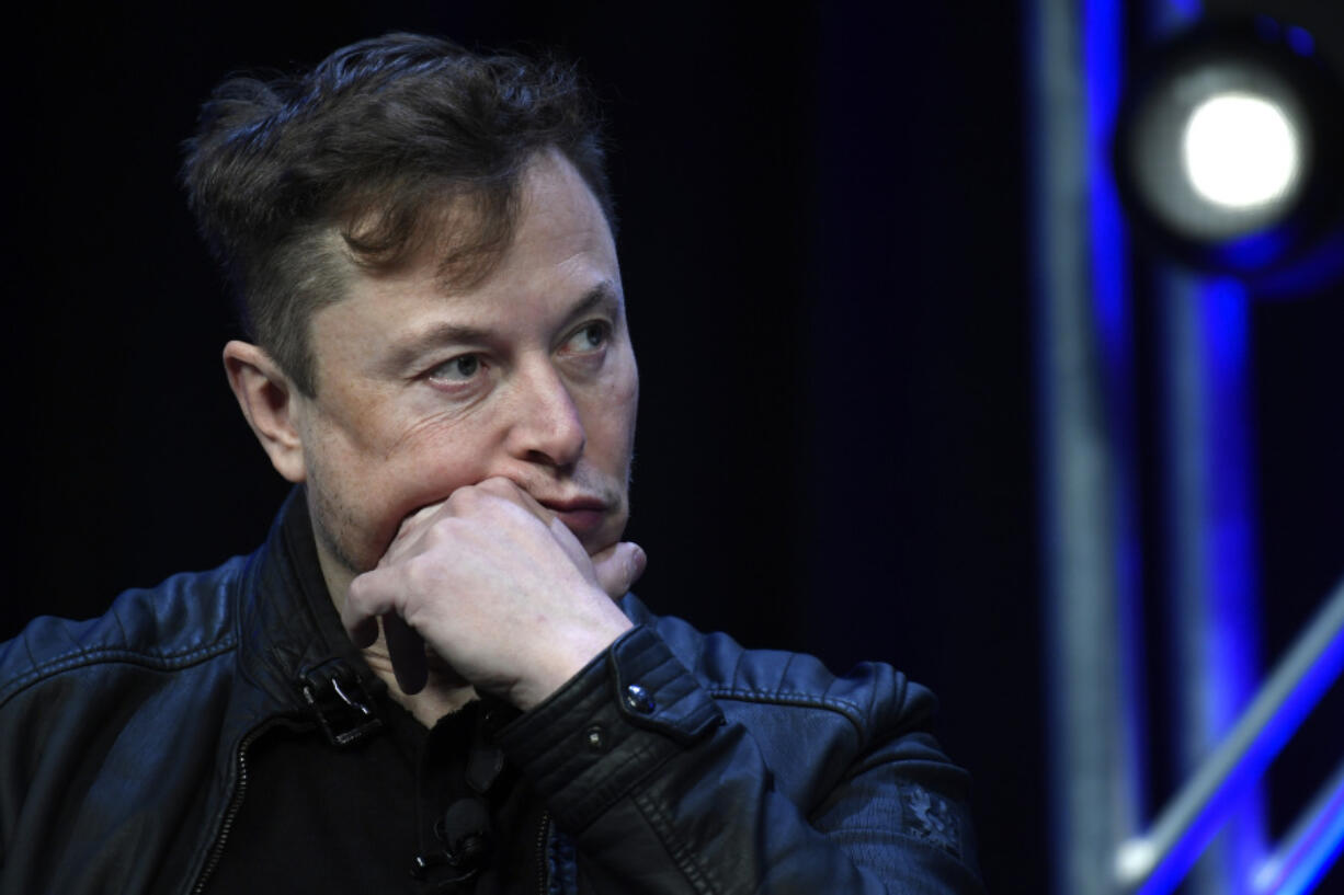 FILE - Tesla and SpaceX chief executive officer Elon Musk listens to a question as he speaks at the SATELLITE Conference and Exhibition in Washington, March 9, 2020. A Delaware judge heard arguments Monday, July 8, 2024, over a massive and unprecedented fee request by lawyers who argued that a massive and unprecedented pay package for Tesla CEO Musk was illegal and should be voided.