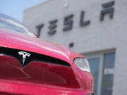 FILE - A Model X sports-utility vehicle sits outside a Tesla store in Littleton, Colo., June 18, 2023. An air quality board has ordered electric car manufacturer Tesla to stop illegally polluting the air in the San Francisco Bay Area.