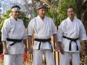 This image released by Netflix shows Ralph Macchio, from left, William Zabka and Yuji Okumoto in the series &ldquo;Cobra Kai.&rdquo; (Curtis Bonds Baker/Netflix via AP)