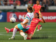 Portland Thorns forward Sophia Smith, right, and San Diego defender Kristen McNabb collide while going for the ball in the first half on Friday, July 5, 2024, at Providence Park in Portland.
