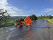 A sign warns of a road closed by flooding in Marshfield, Vt., Thursday, July 11, 2024.