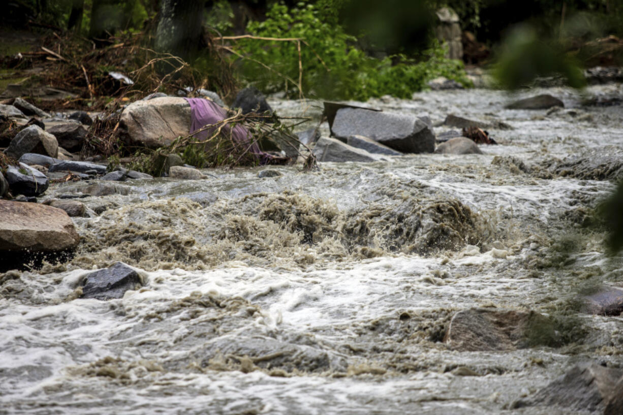 The Winooski River is seen flooded in Plainfield, Vermont. The village was badly hit by the flash flood last night, destroying two bridges and plenty of private houses, Thursday, July 11, 2024.