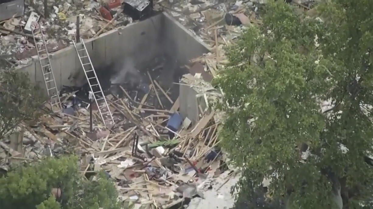 This aerial image made from video provided by WISN shows debris after a house exploded in Elkhorn, Wis., 
 Tuesday, July 2, 2024. The house in southeastern Wisconsin exploded Tuesday, injuring one man who was found trapped in rubble in the basement, authorities said.(WISN via AP)