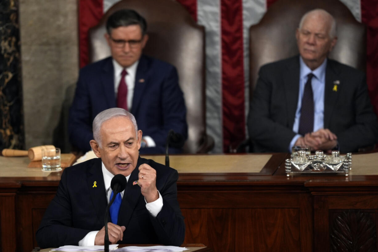 Israeli Prime Minister Benjamin Netanyahu speaks to a joint meeting of Congress at the Capitol in Washington, Wednesday, July 24, 2024, as House Speaker Mike Johnson of La., and Senate Foreign Relations Chair Ben Cardin, D-Md., listen.