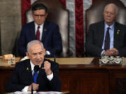 Israeli Prime Minister Benjamin Netanyahu speaks to a joint meeting of Congress at the Capitol in Washington, Wednesday, July 24, 2024, as House Speaker Mike Johnson of La., and Senate Foreign Relations Chair Ben Cardin, D-Md., listen.
