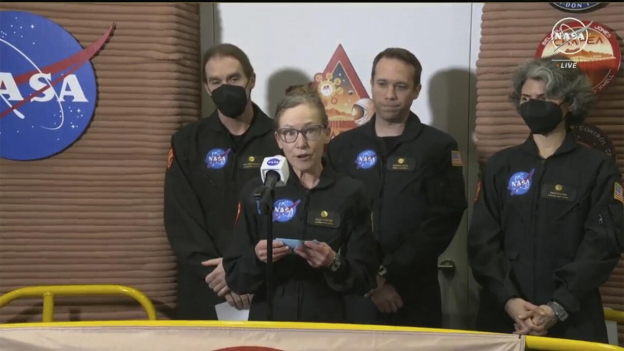 In this image made from video provided by NASA, Kelly Haston, a crew member of the first CHAPEA mission, speaks in front of other members, from left to right, Ross Brockwell, Nathan Jones, and Anca Selariu, Saturday, July 6, 2024, at Johnson Space Center in Houston, Texas. The crew of a NASA mission to Mars emerged from their craft after a yearlong voyage that never left Earth. The four volunteers crew members spent more than 12 months inside NASA&#039;s first simulated Mars environment at Johnson Space Center in Houston, coming out of the artificial alien environment Saturday.