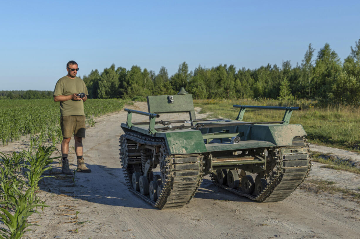 Andrii Denysenko, CEO of design and production bureau &ldquo;UkrPrototyp&rdquo;, stands by Odyssey, an 800-kilogram (1,750-pound) ground drone prototype, at a corn field in northern Ukraine, Friday, June 28, 2024. Facing manpower shortages and uneven international assistance, Ukraine is struggling to halt Russia&rsquo;s incremental but pounding advance in the east and is counting heavily on innovation at home.