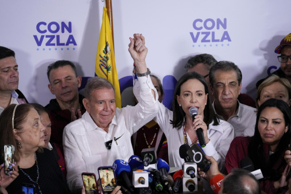 Opposition leader Maria Corina Machado, right, and presidential candidate Edmundo Gonzalez hold a press conference after electoral authorities declared President Nicolas Maduro the winner of the presidential election in Caracas, Venezuela, Monday, July 29, 2024.