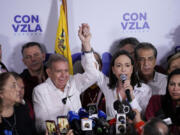 Opposition leader Maria Corina Machado, right, and presidential candidate Edmundo Gonzalez hold a press conference after electoral authorities declared President Nicolas Maduro the winner of the presidential election in Caracas, Venezuela, Monday, July 29, 2024.