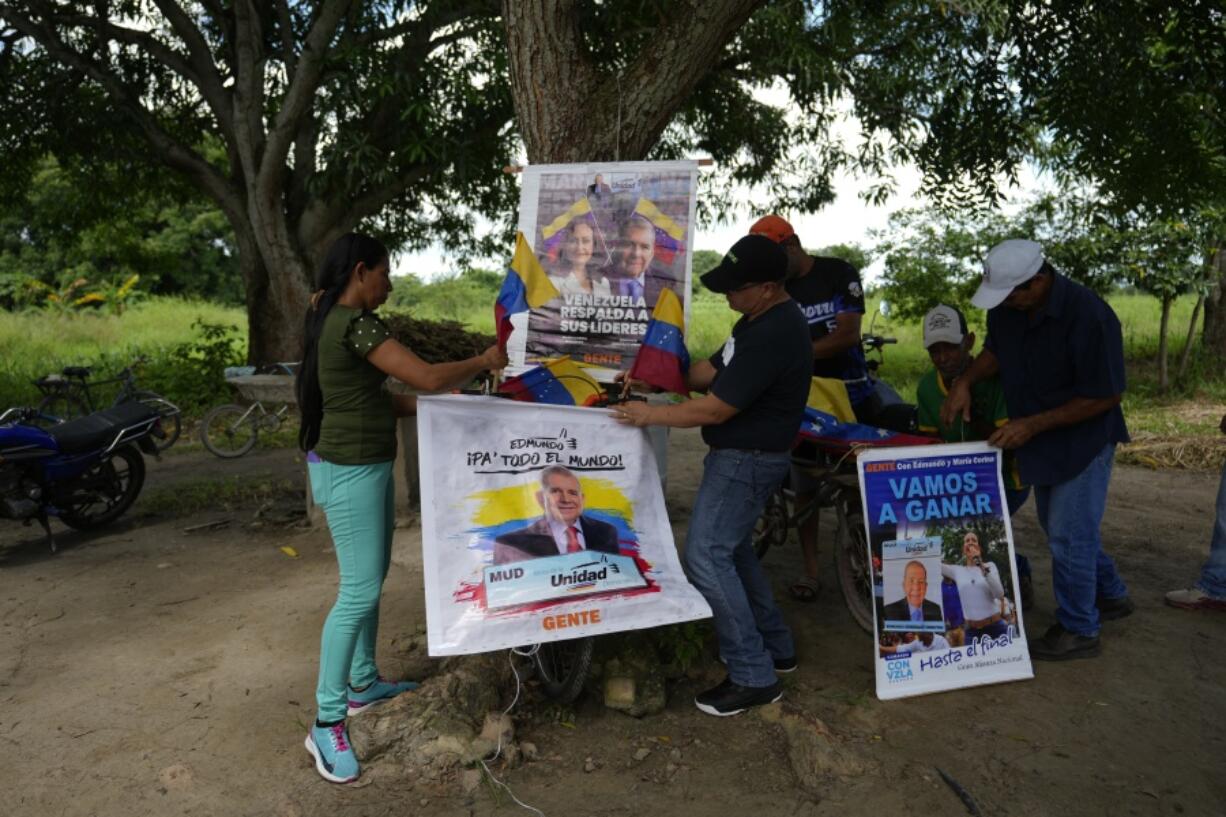 Supporters of opposition presidential candidate Edmundo Gonzalez and leader Maria Corina Machado prepare for a meeting in Sabaneta, Barinas, Venezuela, Sunday, July 7, 2024. Venezuela is set to hold a presidential election on July 28.