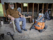 Ed Haggett, 70 poses for a portrait at his house in Montpelier, Vt., July 3, 2024, that was damaged by the 2023 flood. Haggett is waiting to hear whether the city or the Federal Emergency Management Agency will buy his home.