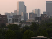 The skyline is obscured by wildfire smoke from blazes in the American West and provinces of western Canada late Wednesday, July 24, 2024, in Denver.