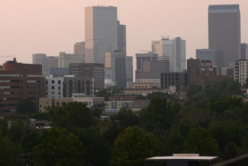 The skyline is obscured by wildfire smoke from blazes in the American West and provinces of western Canada late Wednesday, July 24, 2024, in Denver.