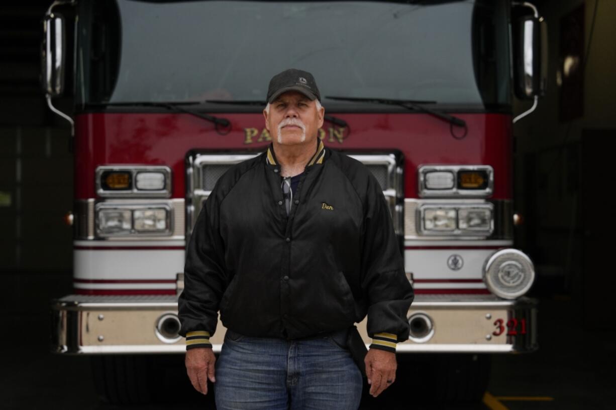 Fire Chief Denny Kingren poses for a portrait, Thursday, May 9, 2024, at the Paxton Volunteer Fire Department, in Paxton, Ill. Local officials and school superintendents, fire chiefs and community college administrators are often among the first to see the economic benefits of wind development. &ldquo;It was a true benefit to our fire department,&rdquo; Kingren said. (AP Photo/Joshua A.