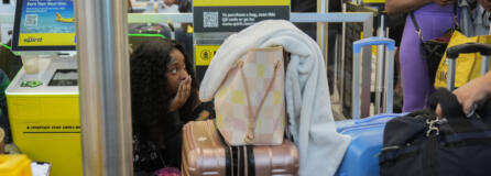 People wait in line at Chicago O&#039;Hare International Airport after a software glitch caused widespread outages, flight delays and cancelations as reported by airlines around the world, Friday, July 19, 2024, in Chicago.