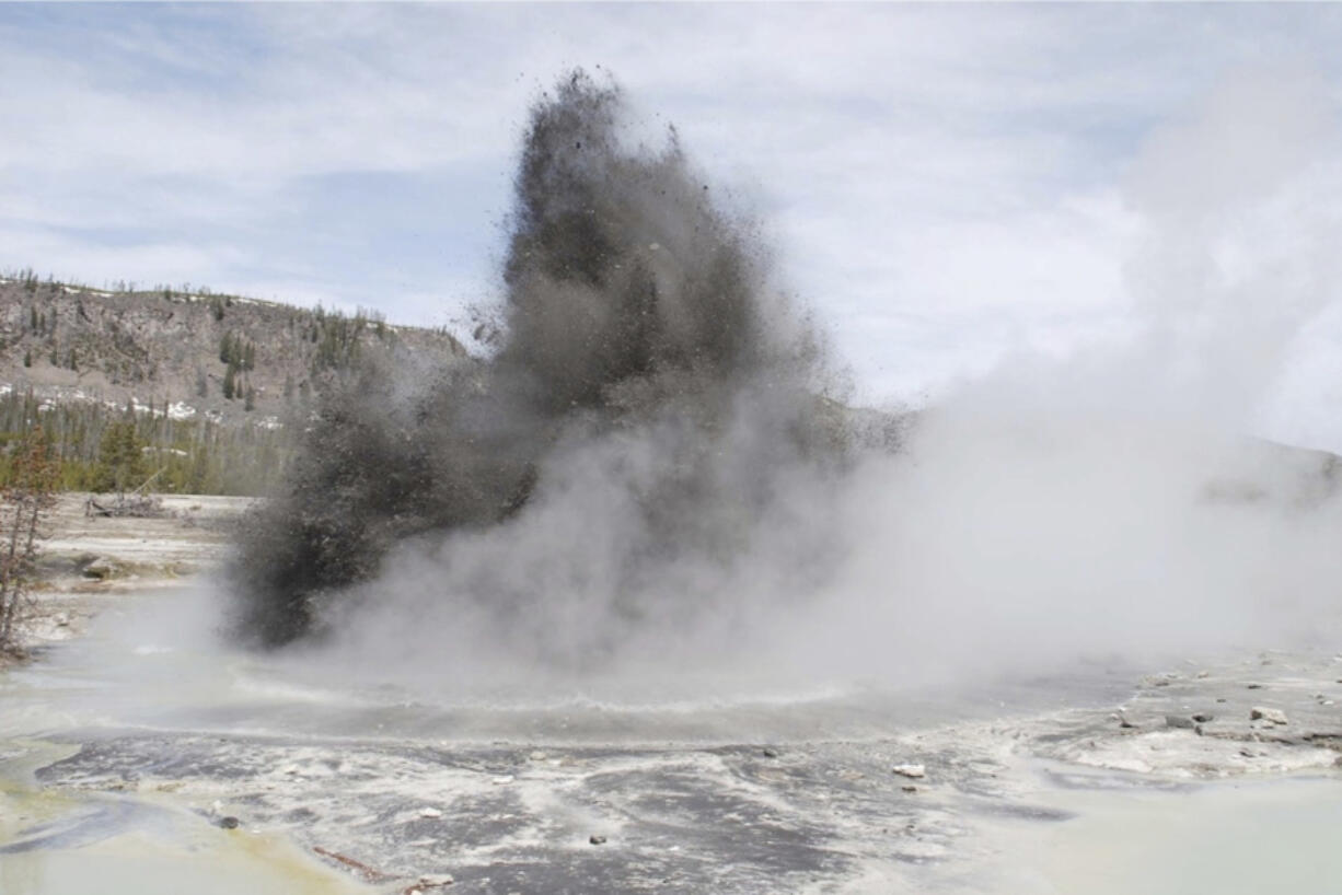 In this image released by the USGS agency, a hydrothermal event is seen in Biscuit Basin in Yellowstone National Park in 2009. Yellowstone officials say a similar explosion on Tuesday, July 23, 2024, sent tourists running for cover and destroyed a boardwalk. They say such events are relatively common.