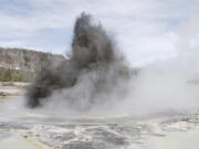 In this image released by the USGS agency, a hydrothermal event is seen in Biscuit Basin in Yellowstone National Park in 2009. Yellowstone officials say a similar explosion on Tuesday, July 23, 2024, sent tourists running for cover and destroyed a boardwalk. They say such events are relatively common.
