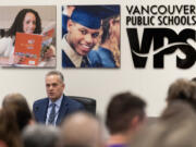 Vancouver Public Schools superintendent Jeff Snell, left, details proposed budget cuts to the district March 12 during a Vancouver Public Schools board meeting at the Bates Center for Educational Leadership. Snell and other district leaders will return to the bargaining table with the Vancouver Education Association next month to work on a new contract for the union.
