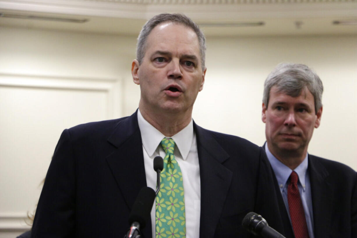 Then Democratic Rep. Ross Hunter, left, discusses a state budget proposal in 2015 in Olympia.