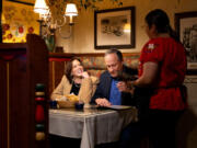 Vice President Kamala Harris, left, and second gentleman Douglas Emhoff order food Oct. 16, 2023, at El Cholo Mexican restaurant in Santa Monica, Calif.