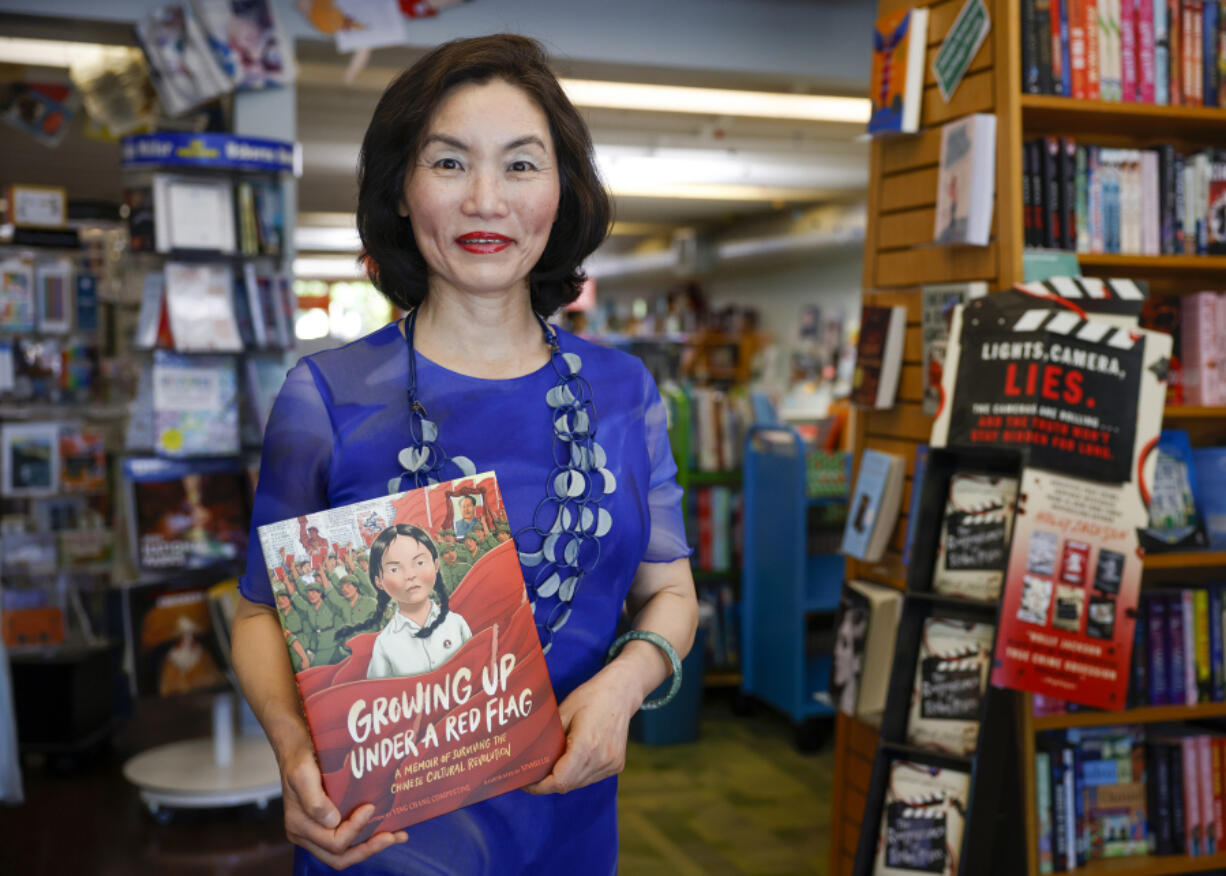 Ying Chang Compestine holds her new book &ldquo;Growing Up under a Red Flag; A memoir of surviving the Chinese Cultural Revolution&rdquo; on May 11 at Linden Tree Books in Los Altos, Calif.