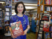 Ying Chang Compestine holds her new book &ldquo;Growing Up under a Red Flag; A memoir of surviving the Chinese Cultural Revolution&rdquo; on May 11 at Linden Tree Books in Los Altos, Calif.