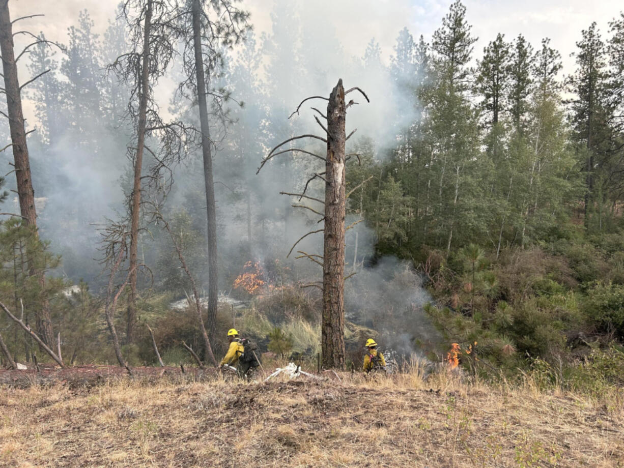 South Columbia Basin fire crews work on the fireline south of Spokane on July 28.