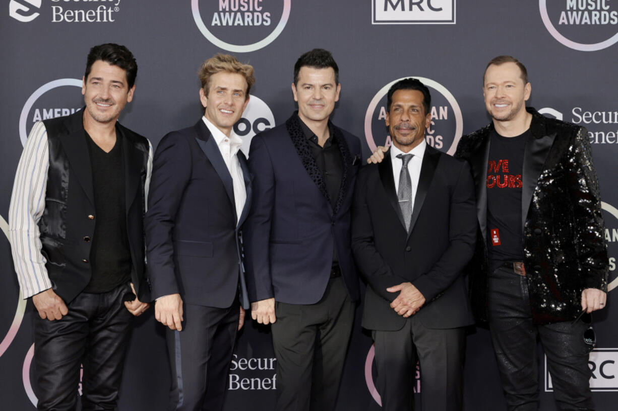 From left, Jonathan Knight, Joey McIntyre, Jordan Knight, Danny Wood and Donnie Wahlberg of New Kids on the Block attend the 2021 American Music Awards at Microsoft Theater on Nov. 21, 2021, in Los Angeles.