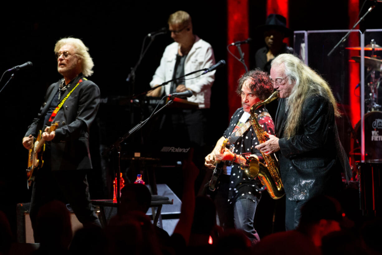 Daryl Hall (left) and John Oates (center) with saxophonist Charles DeChant during a performance at the HoagieNation festival in 2021.