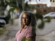 Jennifer Leigh Husbands, 51, is shown near her home Aug. 1 in Chicago. Husbands is Caribbean American; her mother is from Michigan and her father is from Barbados. (Armando L.