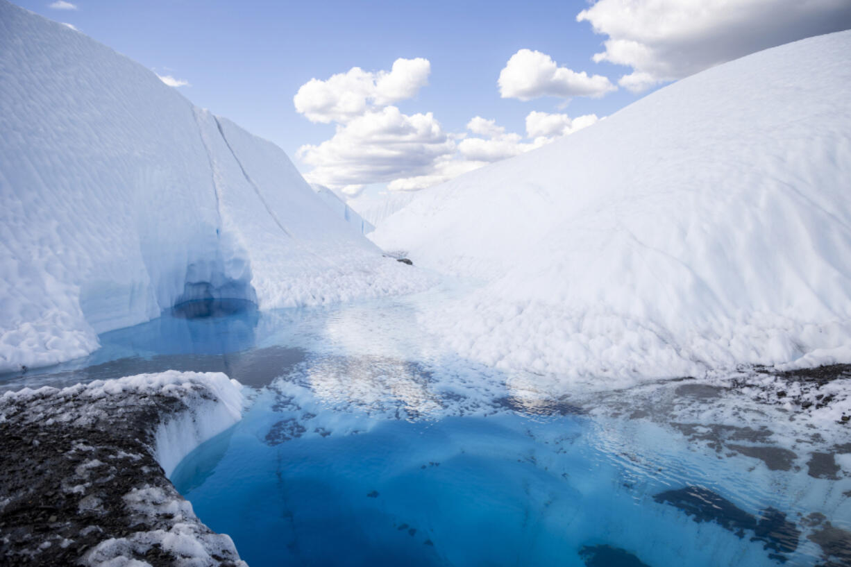 A MICA Guides tour shows the unique icy landscape of the 27-mile-long Matanuska Glacier in Alaska on July 20. Deep holes, flowing glacial streams, ice canyons and blue pools of water define this cold and beautiful landscape.