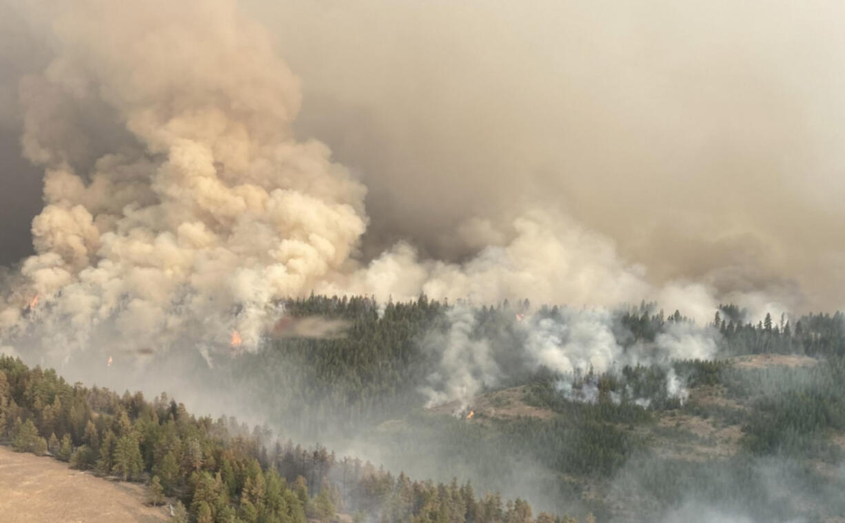 The The Retreat fire, seen here, is burning about 14 miles southwest of Naches, Wash. As of Aug. 8 it was around 44,588 acres and 64% contained.