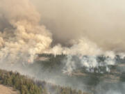 The The Retreat fire, seen here, is burning about 14 miles southwest of Naches, Wash. As of Aug. 8 it was around 44,588 acres and 64% contained.