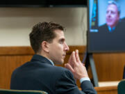 Bryan Kohberger listens to arguments during a hearing to overturn his grand jury indictment on Oct. 26, 2023, in Moscow, Idaho.