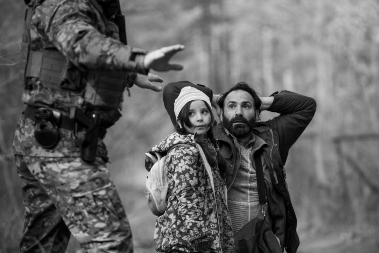 Jalal Altawil, far right, and Talia Ajjan in &ldquo;Green Border.&rdquo; (Agata Kubis/Kino Lorber/TNS)