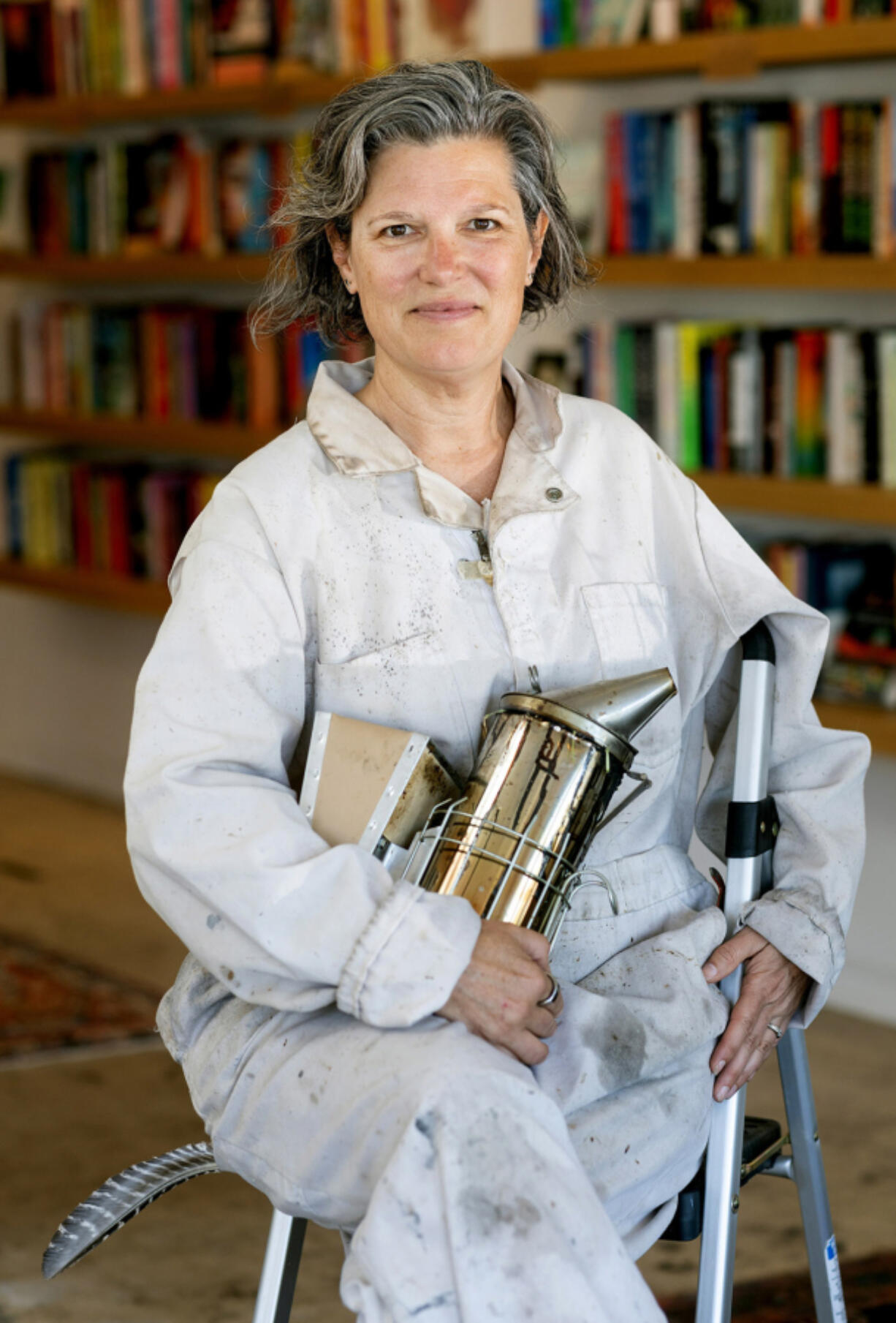 Meredith May, author of &Ccedil;&fnof;&uacute;The Honey Bus,&Ccedil;&fnof;&ugrave; a memoir about growing up in Carmel Valley, wears the overalls of her beekeeper grandfather while posing for a portrait at Olivia &amp; Daisy Books in Carmel Valley, California, Thursday, May 30, 2024.