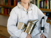 Meredith May, author of &Ccedil;&fnof;&uacute;The Honey Bus,&Ccedil;&fnof;&ugrave; a memoir about growing up in Carmel Valley, wears the overalls of her beekeeper grandfather while posing for a portrait at Olivia &amp; Daisy Books in Carmel Valley, California, Thursday, May 30, 2024.