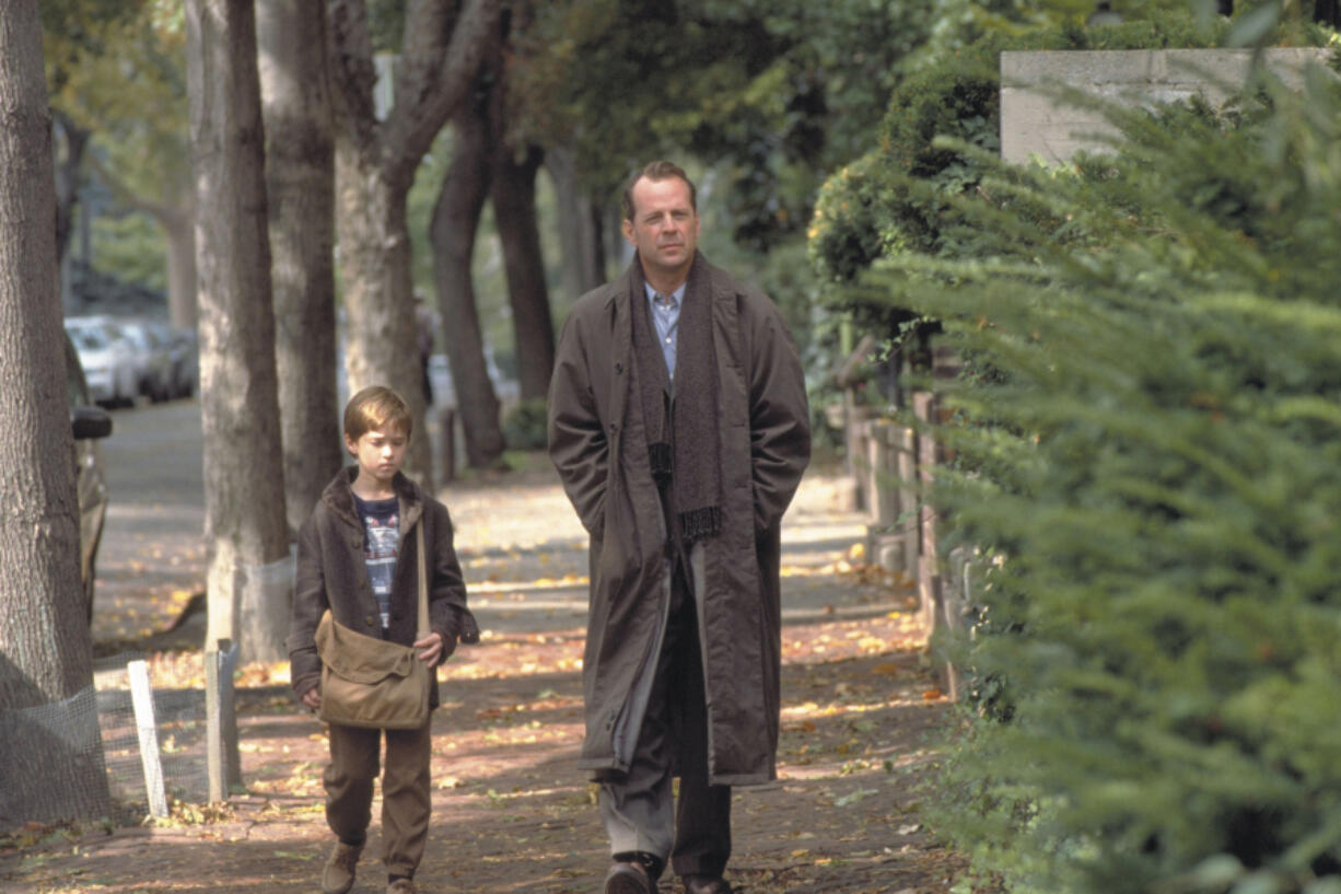 Haley Joel Osment, left, and Bruce Willis in &ldquo;The Sixth Sense.&rdquo; (Zuma Press)