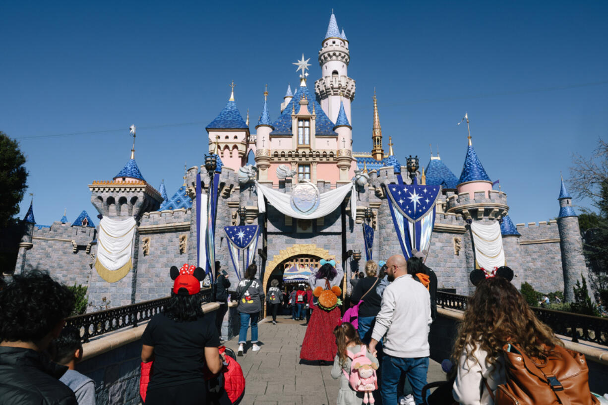 Parkgoers visit Disneyland in Southern California on Jan. 26.