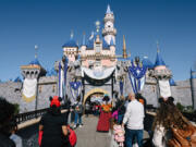 Parkgoers visit Disneyland in Southern California on Jan. 26.