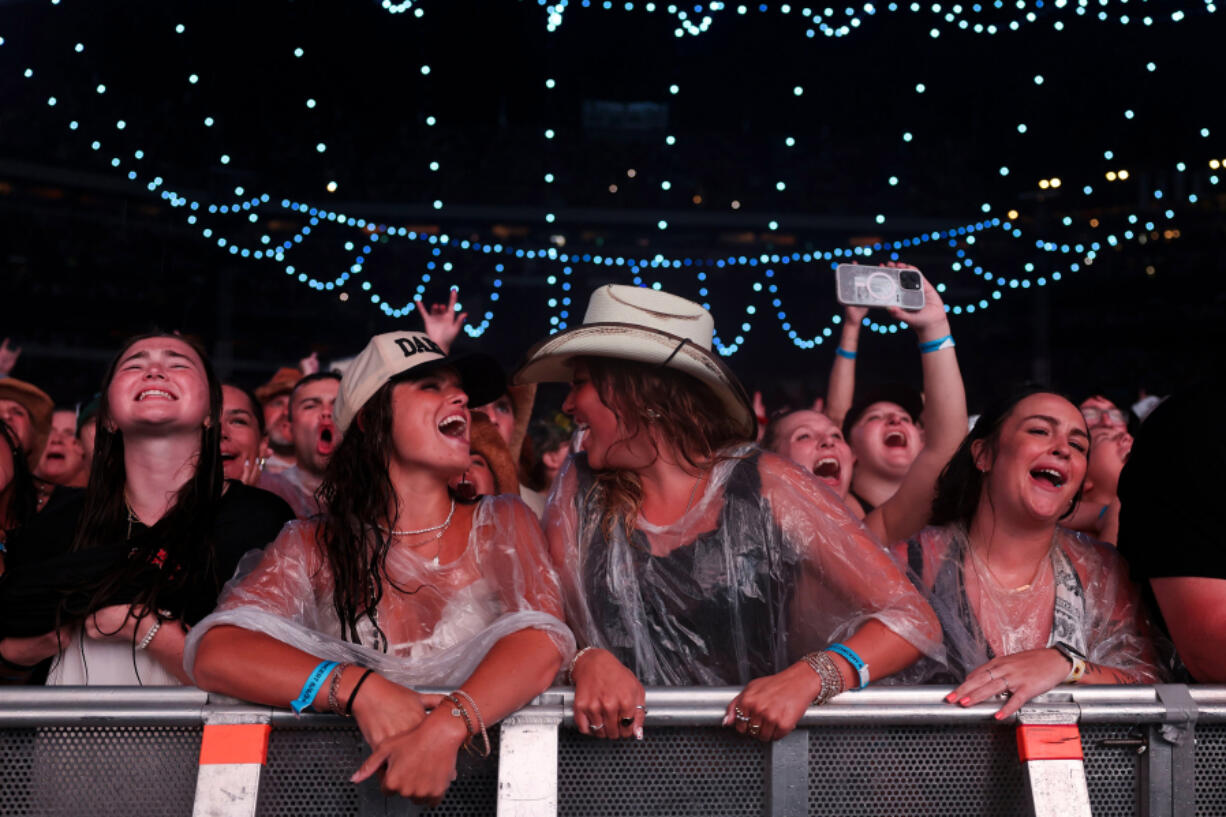 Fans cheer as Zach Bryan performs at Lincoln Financial Field on Aug. 6, 2024, in Philadelphia. Bryan took stage an hour late due to severe rain storms that had 60,000 fans rush to shelter.