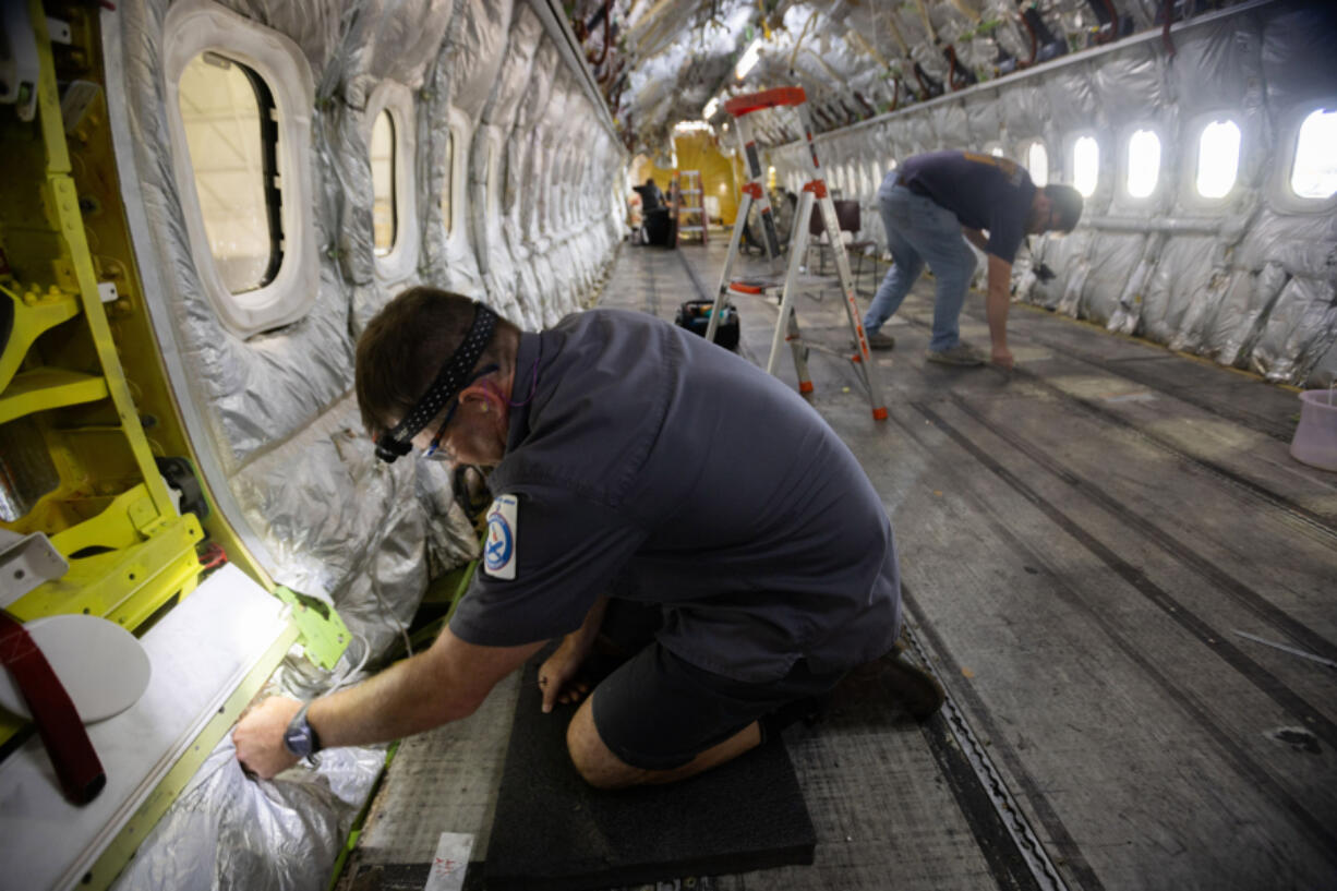 Aircraft maintenance technician Chris Streeter secures electrical wires during a routine 6-year maintenance inspection on a Boeing 737-800 at the American Airlines&rsquo; Tech Ops in Tulsa on Tuesday, June 18, 2024. This 246-acre maintenance facility has over 5,000 workers.