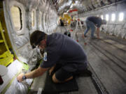 Aircraft maintenance technician Chris Streeter secures electrical wires during a routine 6-year maintenance inspection on a Boeing 737-800 at the American Airlines&rsquo; Tech Ops in Tulsa on Tuesday, June 18, 2024. This 246-acre maintenance facility has over 5,000 workers.