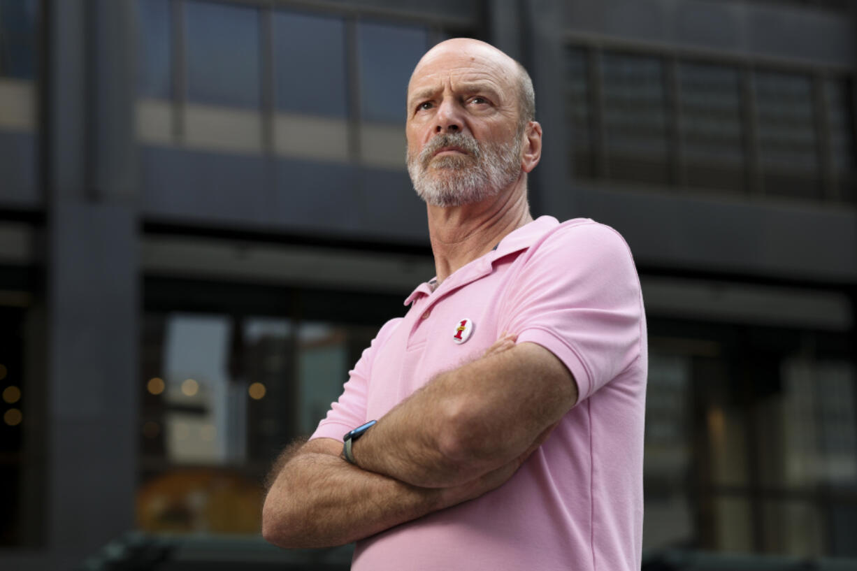 Jim P&Ccedil;&fnof;&Ugrave;Pool, a former Signature Room server, stands in front of 875 N. Michigan Ave., the former home of The Signature Room, in the Streeterville neighborhood on July 30, 2024. (Eileen T.