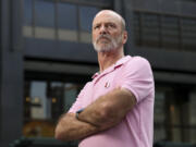 Jim P&Ccedil;&fnof;&Ugrave;Pool, a former Signature Room server, stands in front of 875 N. Michigan Ave., the former home of The Signature Room, in the Streeterville neighborhood on July 30, 2024. (Eileen T.