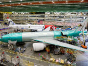 Boeing employees build 777 aircrafts under production at the Everett Production Facility on June 26, 2024 in Everett, Washington. The 777X, Boeing&#039;s latest incarnation of the popular 777 family, has received more than 500 orders, although it has not yet entered commercial service. Boeing had originally planned for the jet to enter service in January 2020. But the timeframe has been pushed back to 2025 due to certification delays. The jet still must be certified by the US Federal Aviation Administration.