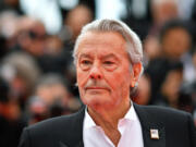 French actor Alain Delon poses as he arrives to be awarded with an Honorary Palme d&rsquo;Or at the 72nd edition of the Cannes Film Festival in Cannes, southern France, on May 19, 2019.